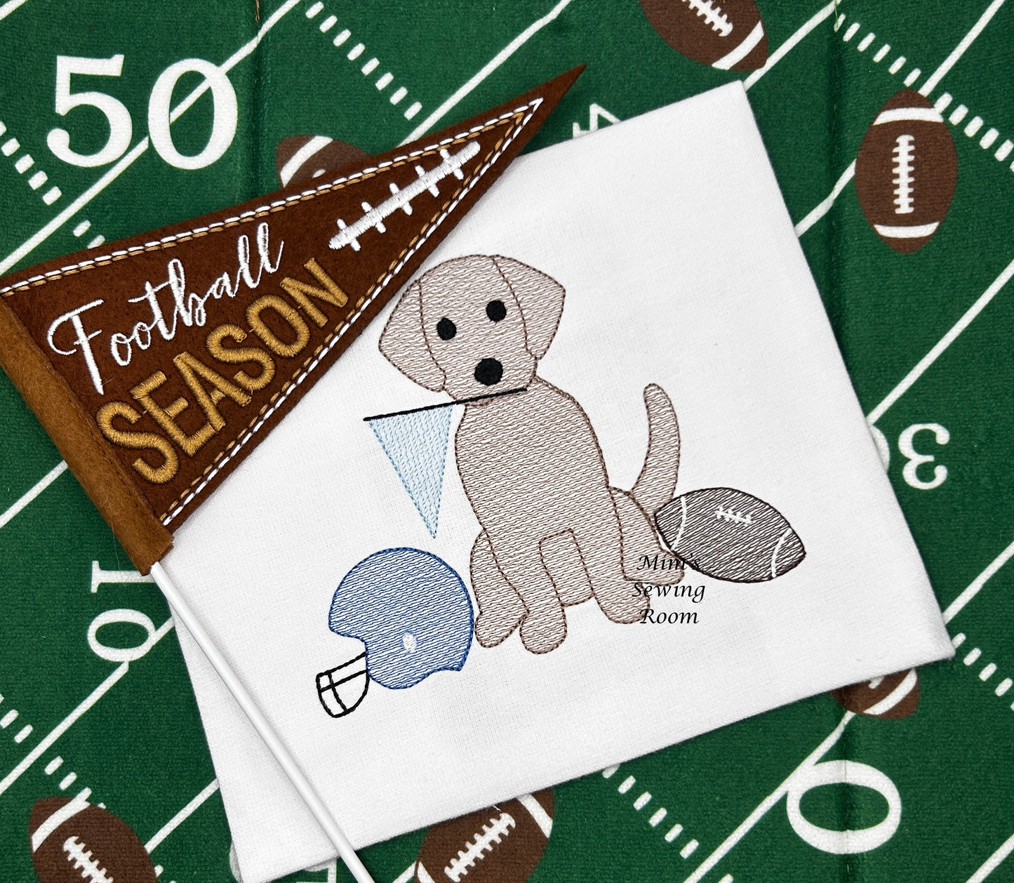 Football dog with pennant, helmet, and football