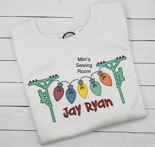 Lineman on poles with Christmas lights