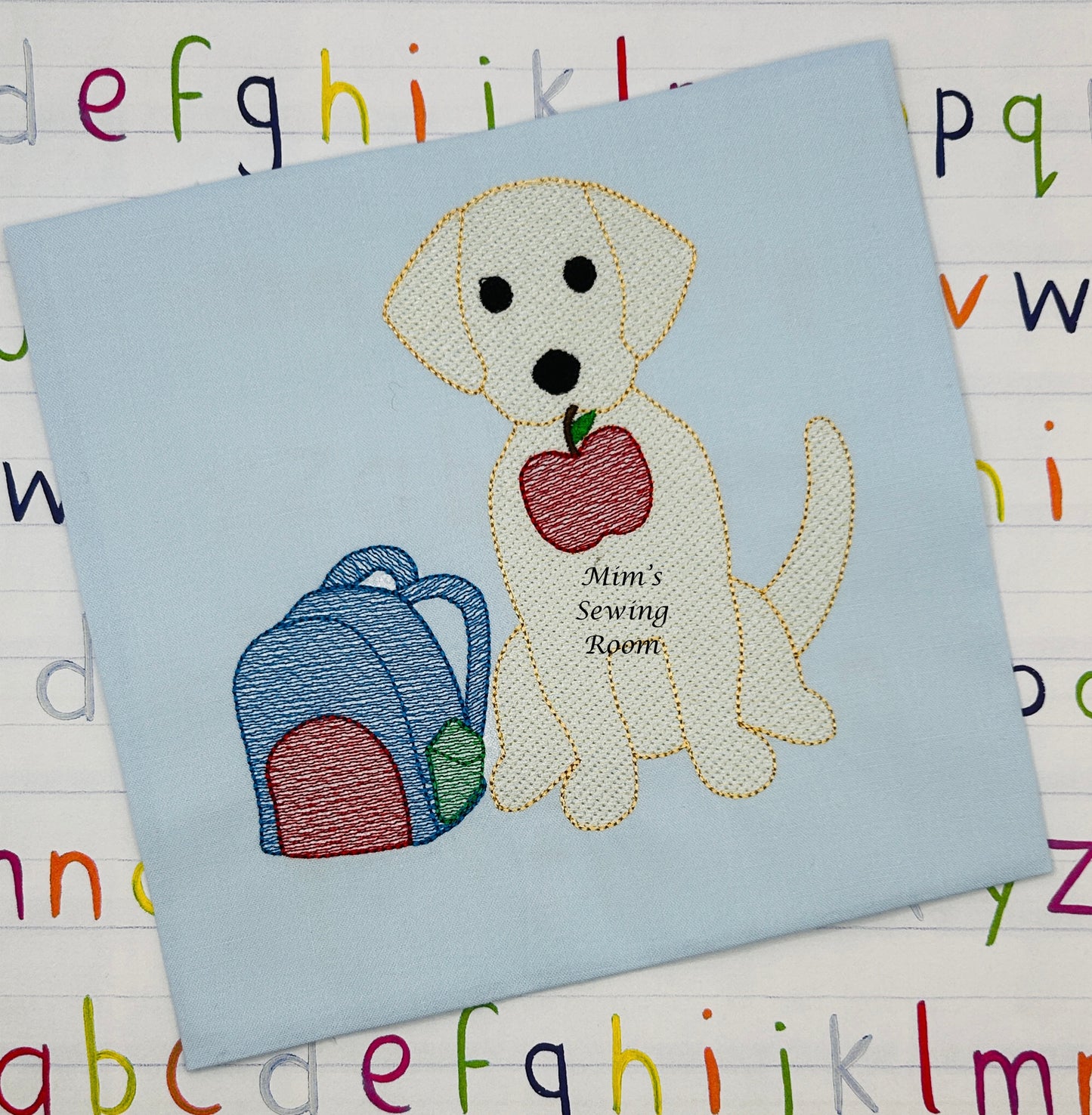 Back to school dog with backpack and apple