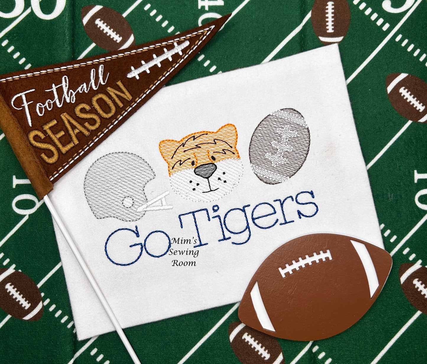 Tiger trio with helmet and football